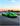 Shift Culture's Green Lamborghini STO on a racetrack with a sunset sky
